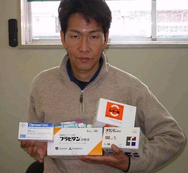 Photo: Kubota with boxes of medicals